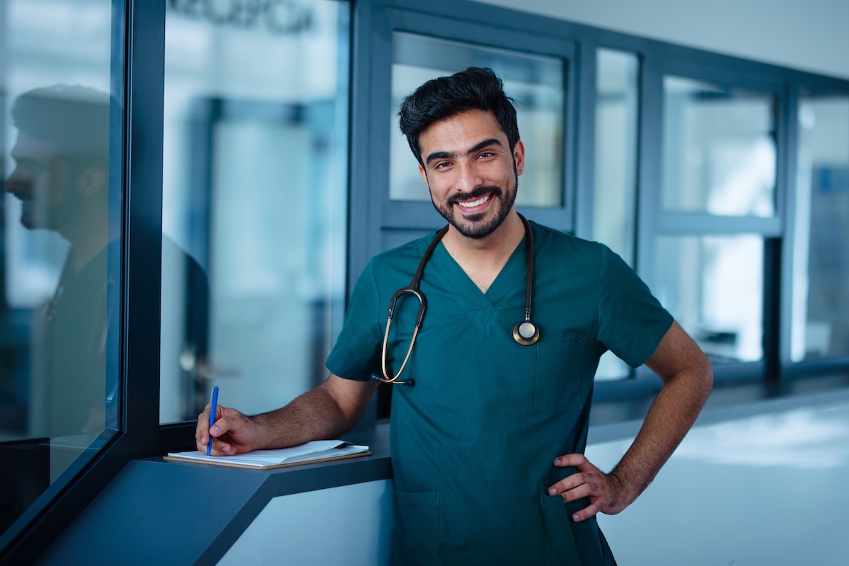 Portrait of young doctor at hospital room.
