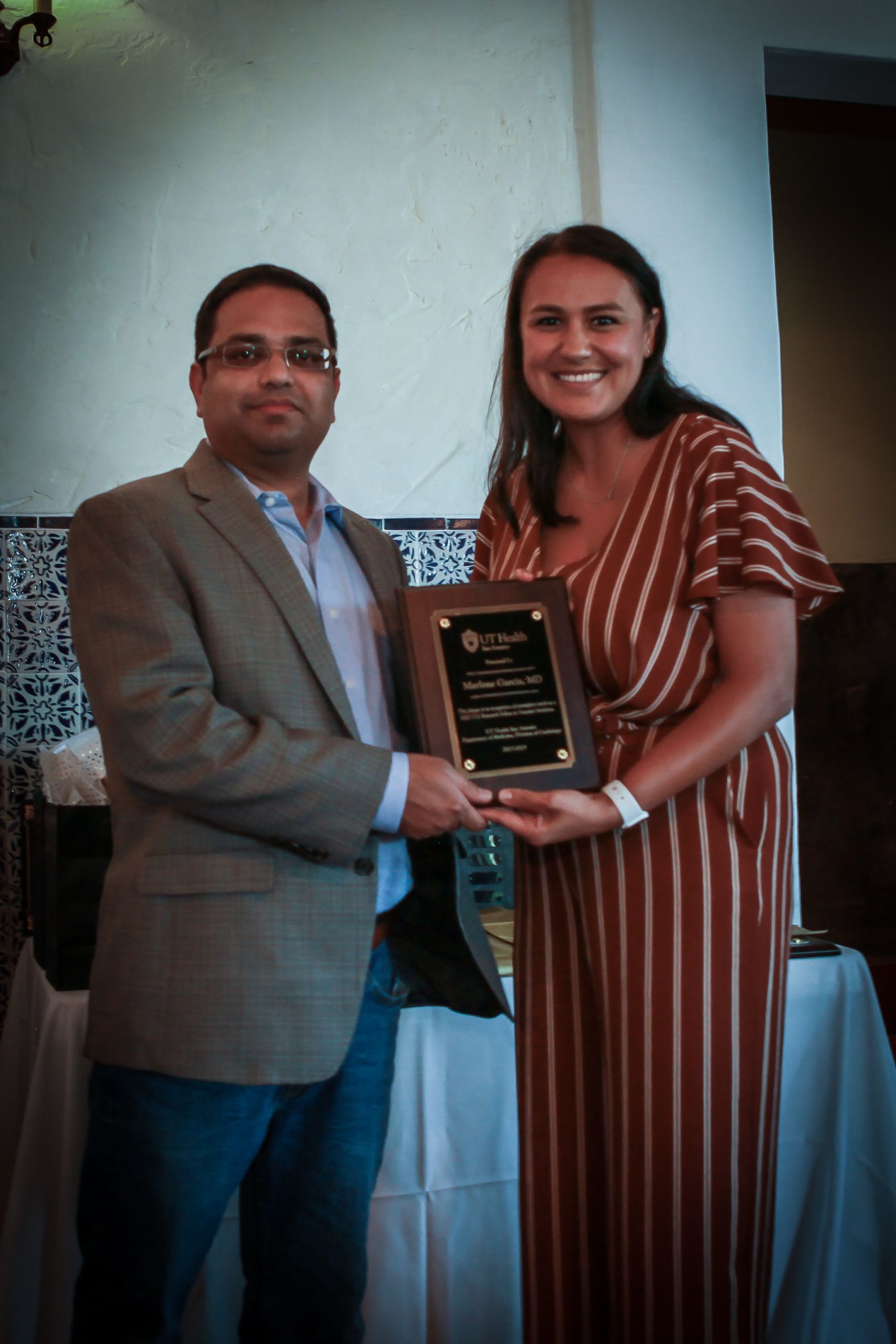 Dr. Prasad presenting Dr. Marlene Garcia with the NIH Research Award, 2019