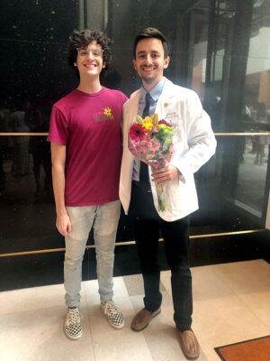 Program alum Noah Lawrence meets up with now-medical student Christopher File at the UTMB John Sealy School of Medicine