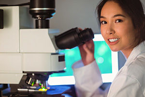 Research doctor with a microscope