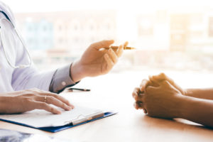 Doctor explaining care to patient