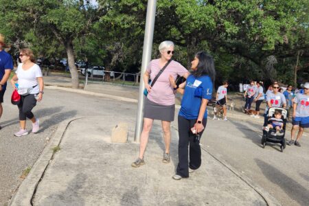 A couple women talking at the event