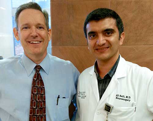 Dr. Seifi and Patient Jeff Damon standing together and smiling.