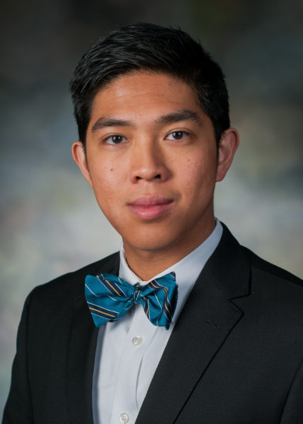 Dr. Christopher Sy smiling for his staff photo.