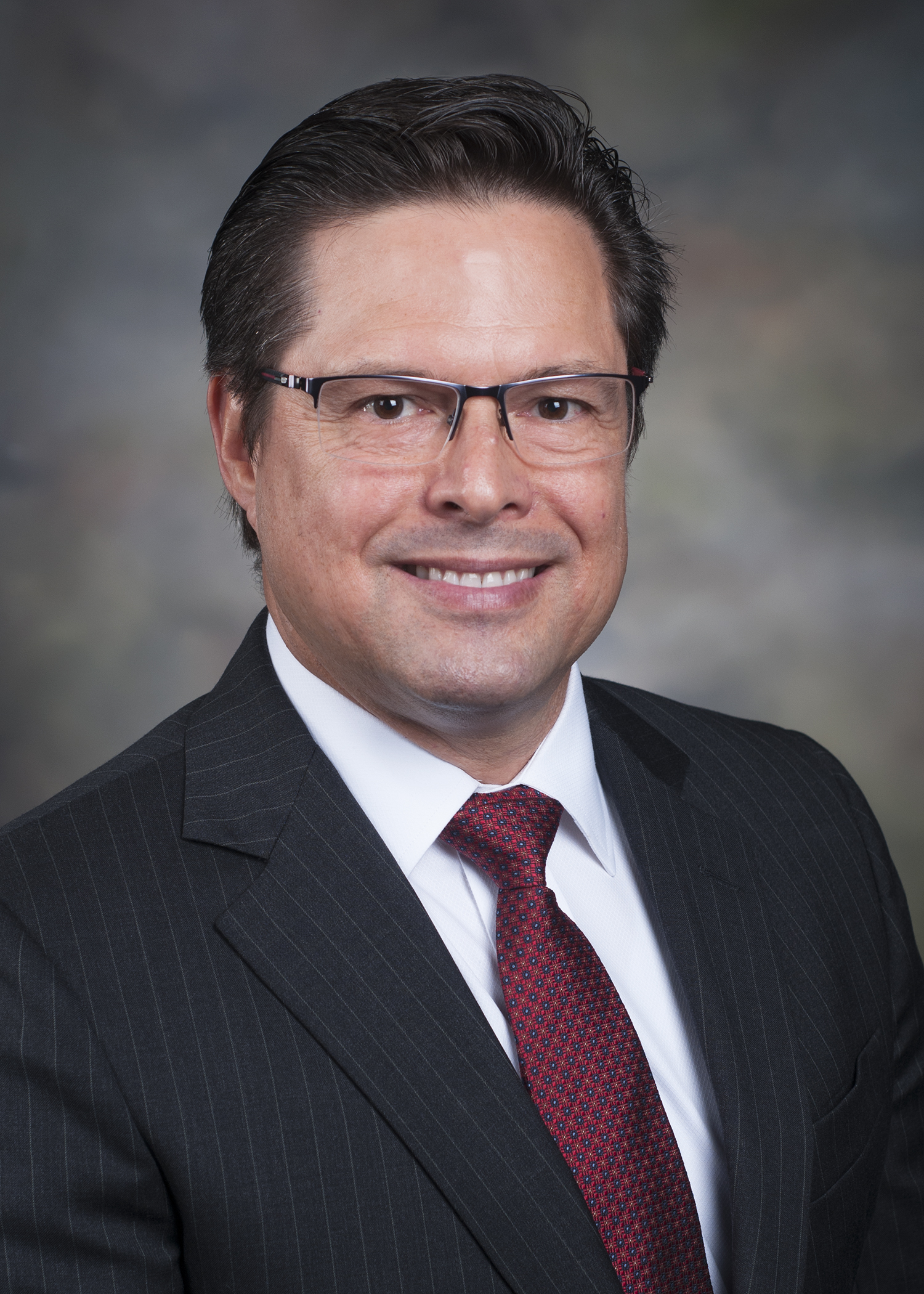 Darren Poidevin smiling for his staff photo.