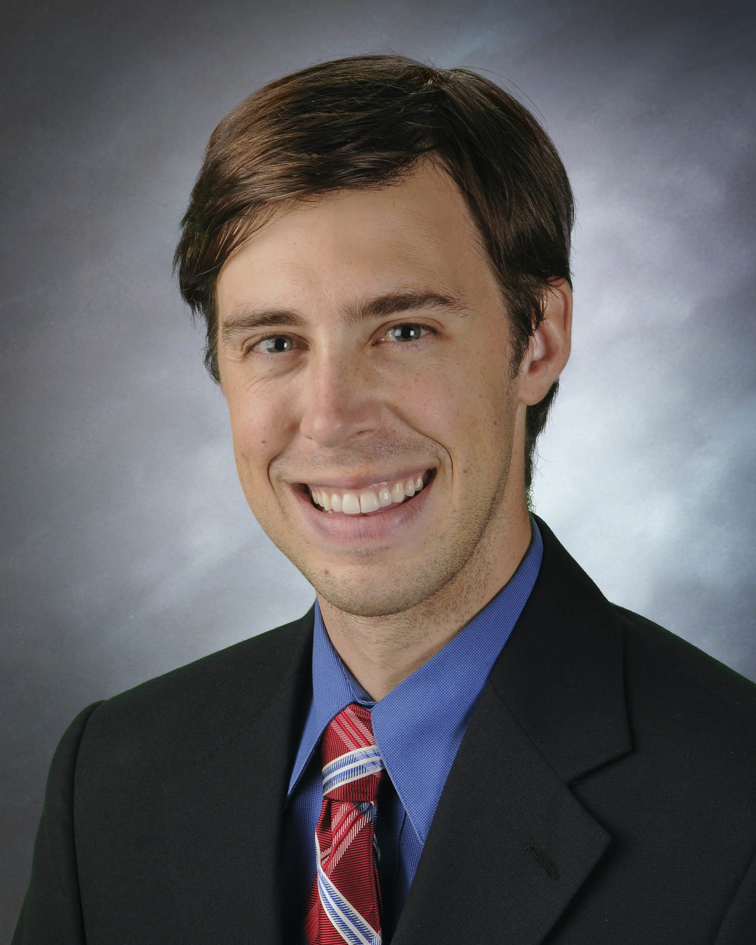 Feature image Dr. Grant Booher smiling for his staff photo.