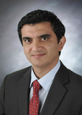 Dr. Ali Seifi smiling for his staff photo.