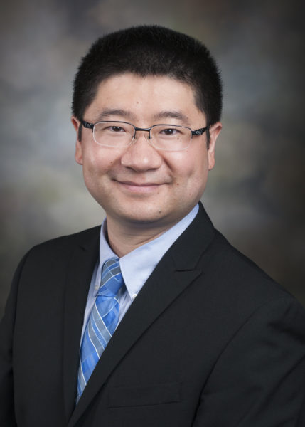 Dr. Derrick Sun smiling for his staff photo.