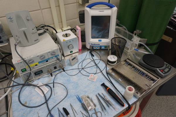 A lab tabletop with various instruments and tools.