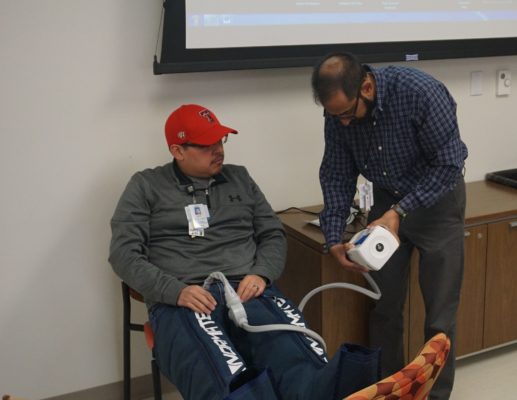Dr. Shaheryar Hafeez demonstrates how to operate the NormaTec Pulse compression device.