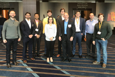 A collection of faculty and residents from the Department of Neurosurgery standing in front of ballroom at the 2018 TANS meeting.