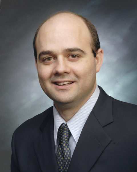 Dr. Mateo Ziu smiling for his staff photo.