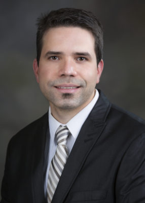 Dr. Erick Garcia Gorbea smiling for his staff photo.