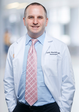 Dr. Mascitelli smiles for staff photo.