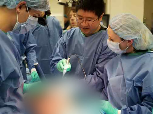 Dr. Derrick Sun and others working hard in the anatomy lab.