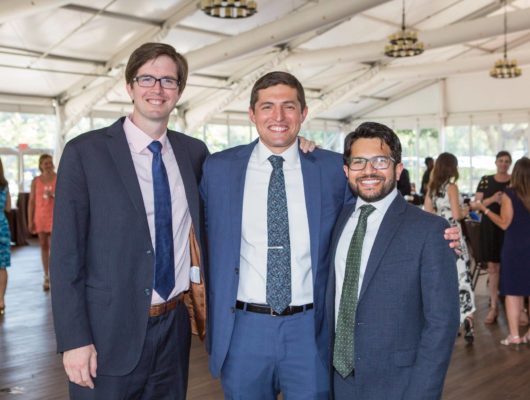 Drs. Michael McGinity, Shane Hawksworth, and Asif Maknojia standing together and smiling. They are standing left to right in order of descending height.