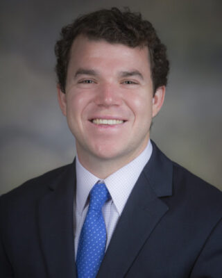 Dr. Jonathan Fisher smiling for his staff photo.