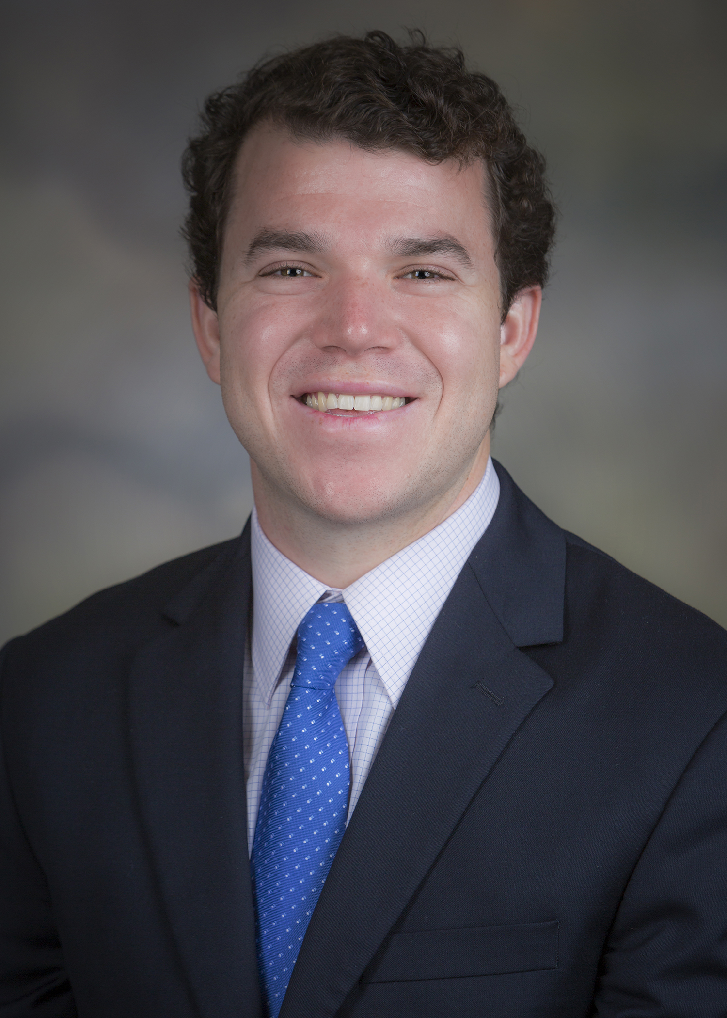 Feature image Dr. Jonathan Fisher smiling for his staff photo.
