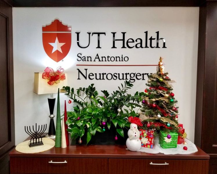 An array of festive holiday items sprawling across a tabletop in the Department of Neurosurgery.