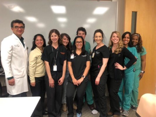 Neurocritical Care Team posing for a group photo after their simulation lab taught by Drs. Seifi and Garvin.