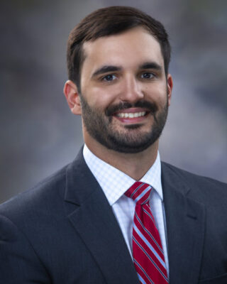 William Chase Johnson poses in a suit and tie for his profile photo.