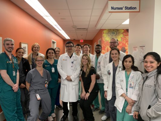 The Neuro Intensive Care Unit team members pose with our new residents and medical students who will be rotating with us the month of July 2019.