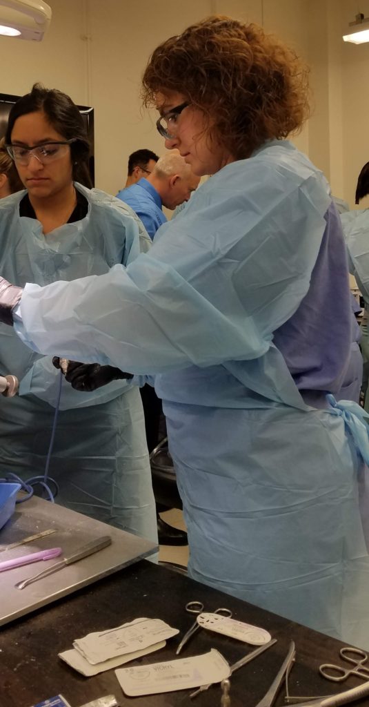 Participants work in the cadaver lab.