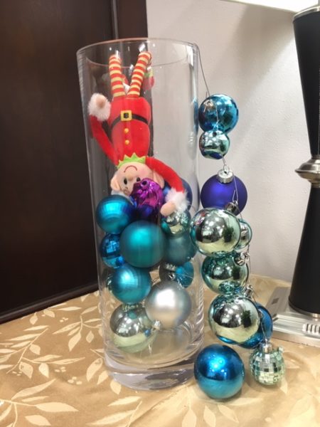 Neuro Elf in a glass jar with blue ornaments.