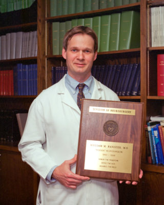 Dr. William Banister receiving plaque