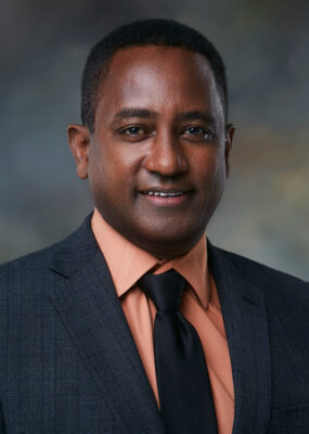Fassil B. Mesfin, MD, PhD, smiles for his photo.
