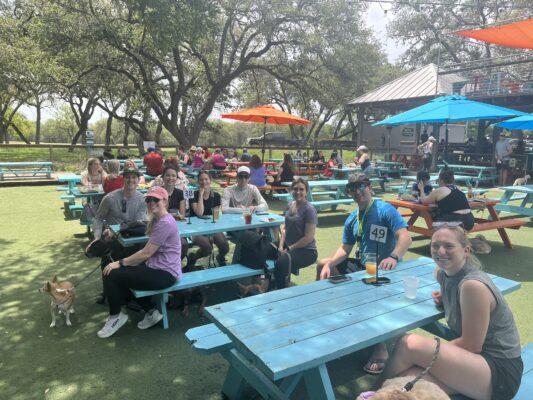 Department team members gather at a table.