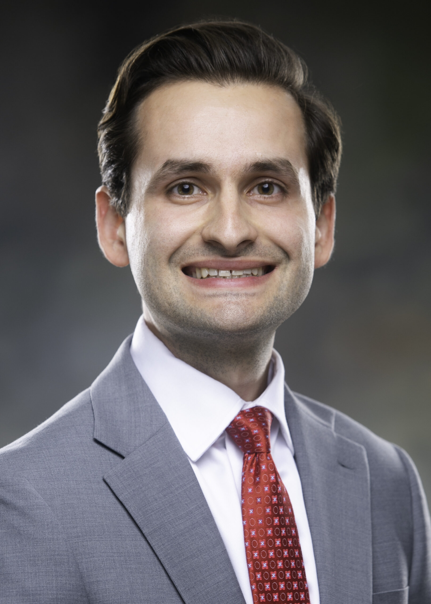 Dr. Kaculini smiles for his profile photo.