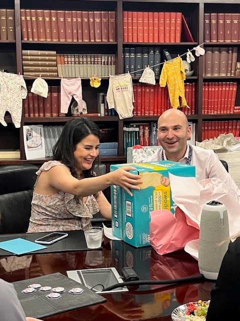Dr. Al-Saiegh and his wife, Sally, receive gifts at their baby shower.
