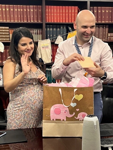Dr. Al-Saiegh and his wife, Sally, receive gifts at their baby shower.