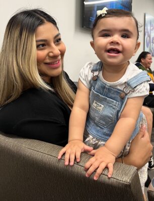 Camila and her mother pose for a photo with their physicians at their two week follow up.