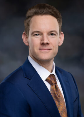 Conor Cunningham smiles for his portrait photo,