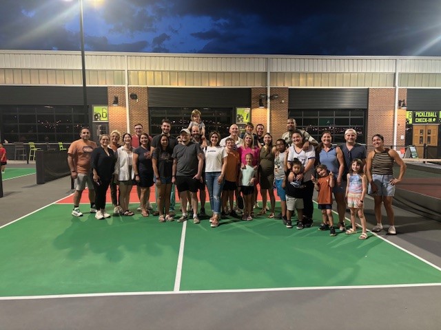 Groupe photo of department team members at Chicken N Pickle.