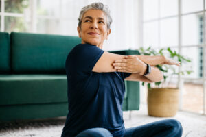 Happy senior doing yoga