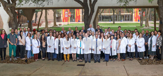 UT Health pediatrics faculty and staff standing together on the campus grounds