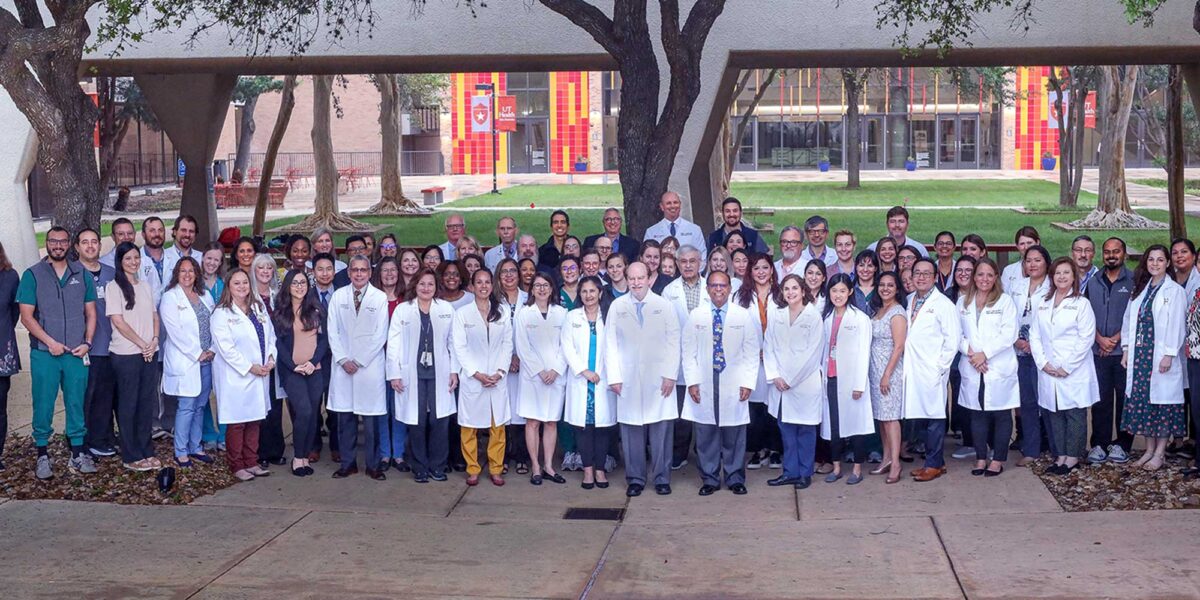 UT Health pediatrics faculty and staff standing together on the campus grounds