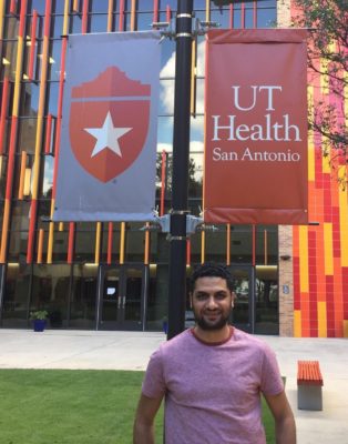 UT Health San Antonio student standing in front of ALTC building