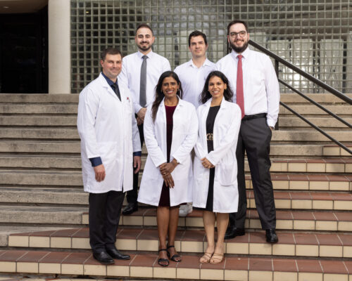 2026 graduating class standing on Briscoe Library steps
