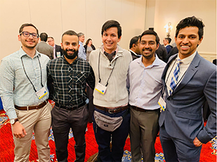 five residents poising for picture at Interventional Radiology conference