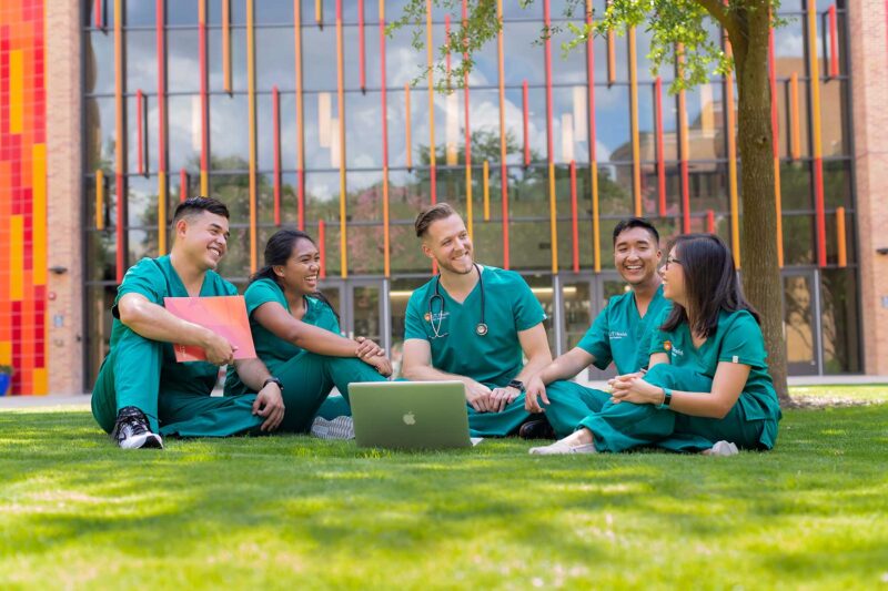 medical students on lawn of the ALTC building at UT Health San Antonio
