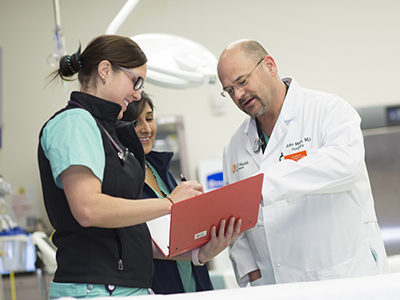 Doctor educating students